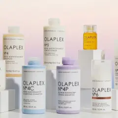 Colección de productos Olaplex para cabello seco o mojado, incluyendo champús, acondicionadores y tratamientos.