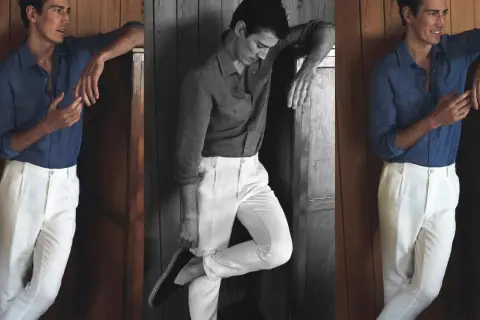 Hombre con camisa azul y pantalón blanco, un look ideal que combinar con pantalón blanco hombre para un estilo veraniego.
