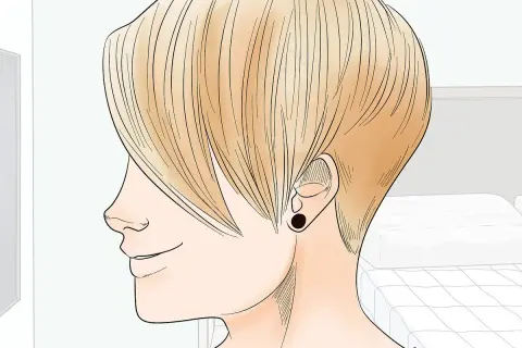 Perfil de persona con cabello rubio, mostrando la transición de pelo corto a largo. Se ve un pendiente negro.