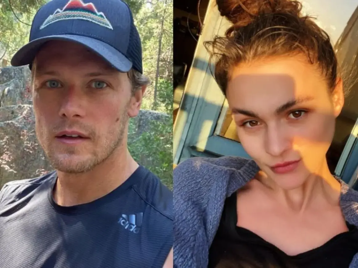 Sam Heughan, con gorra y camiseta deportiva, y una mujer con el pelo recogido y un suéter azul. Podrían ser una pareja.