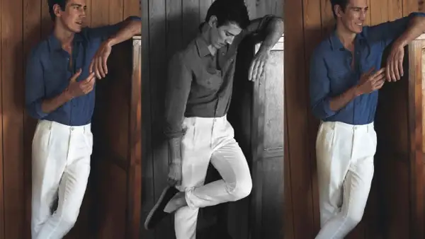 Hombre con camisa azul y pantalón blanco, un look ideal que combinar con pantalón blanco hombre para un estilo veraniego.